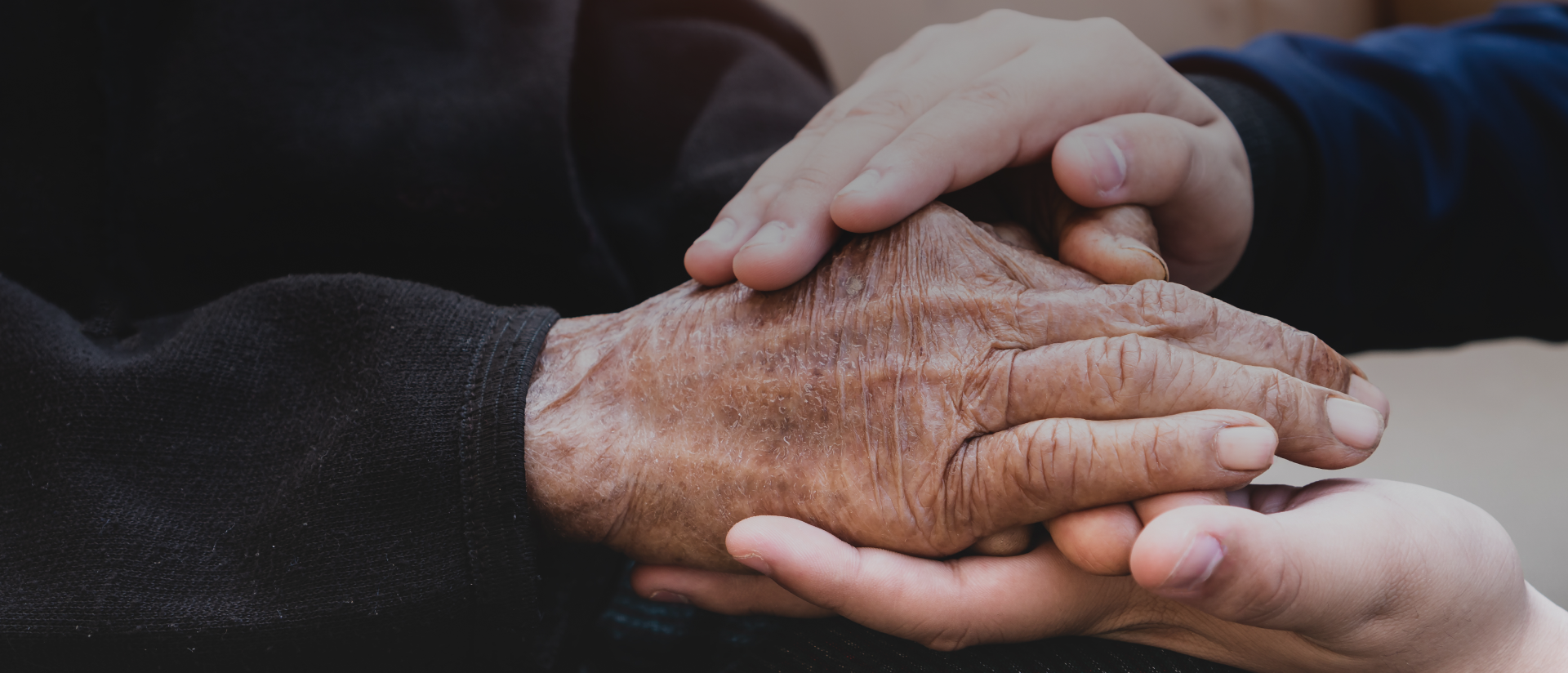 Two people holding hands