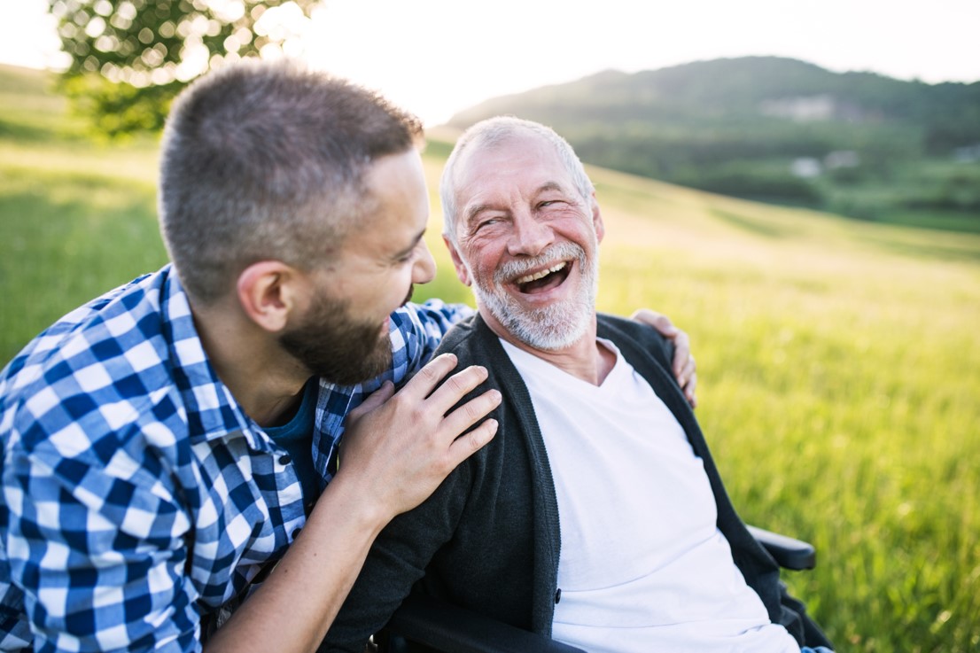 a man hugging another man