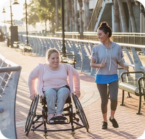 a woman in a wheelchair and a woman running