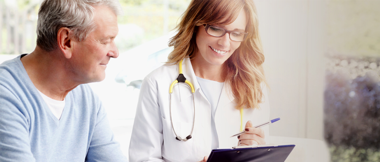 a doctor and a patient looking at tablet