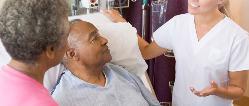 a doctor speaking to a patient and a woman