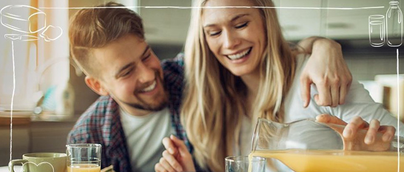 a man and a woman drinking juice