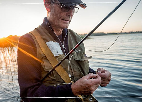 a man holding a fish