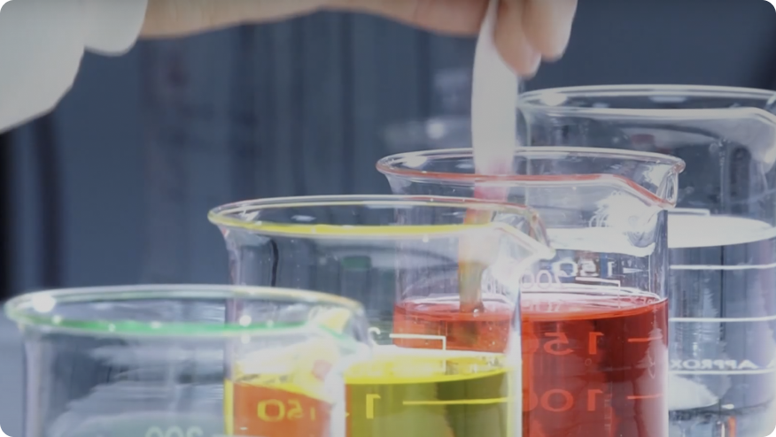 a group of glass cups with liquid in them