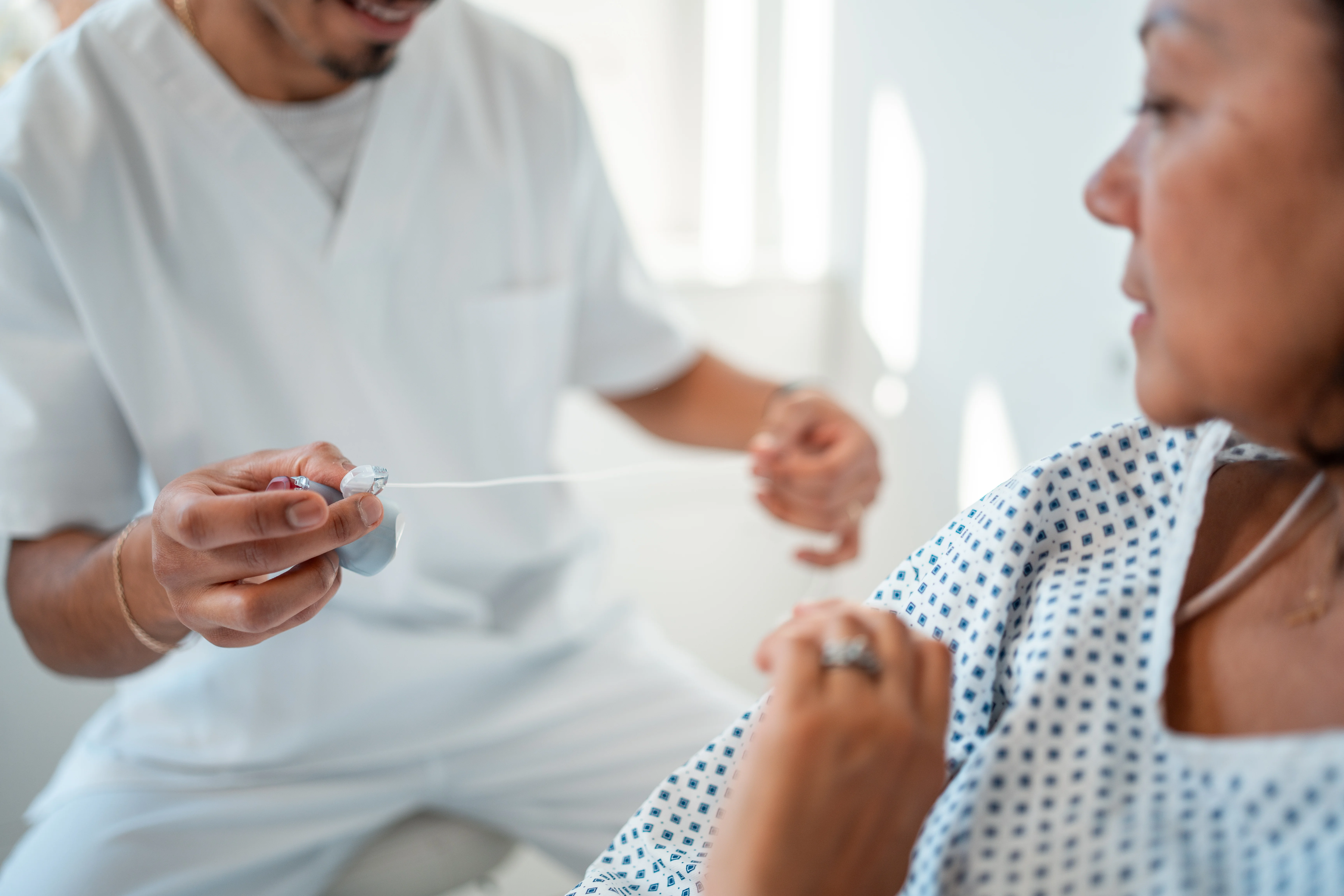 a doctor checking a patient's blood pressure