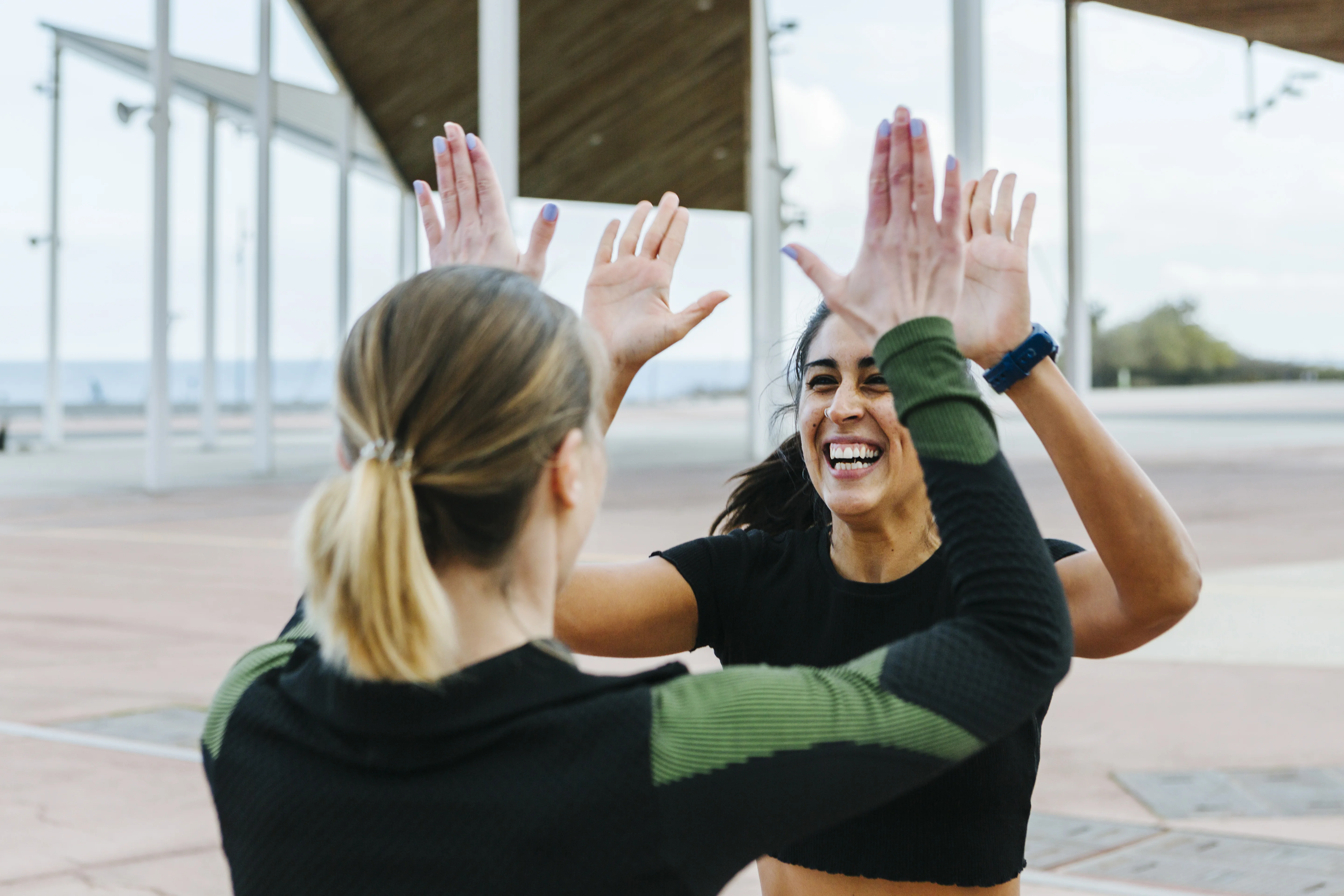 a woman with her hands up