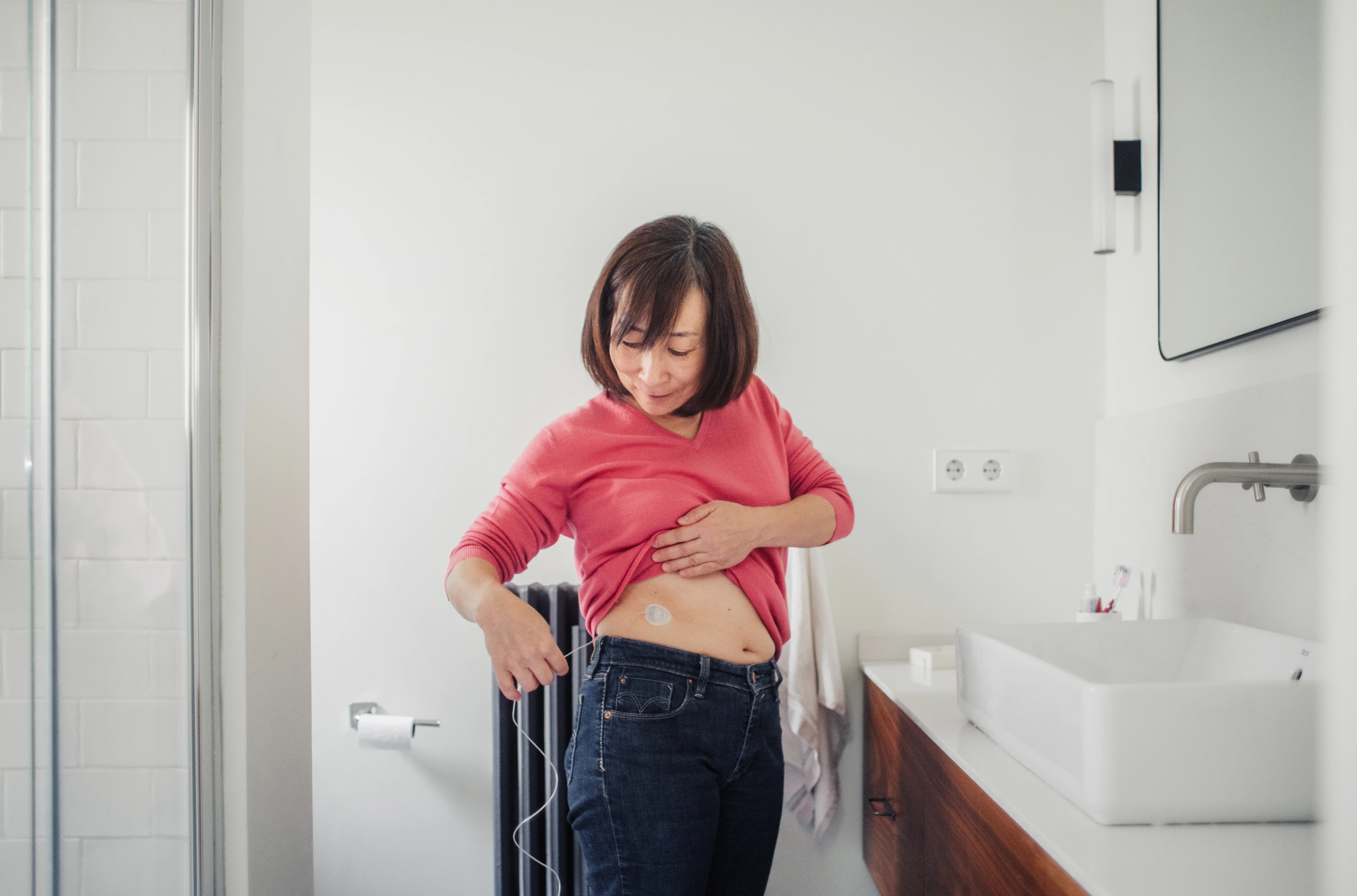 a woman standing in a bathroom